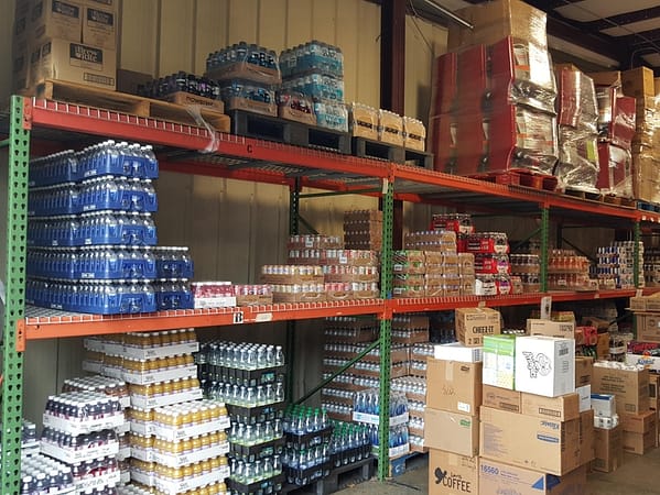 Pallet rack with wire deck filled with product in a warehouse.