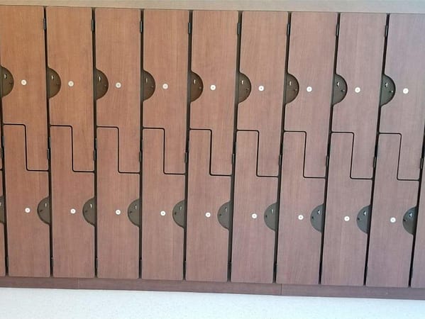 Phenolic z-lockers in a hallway, with a wood style finish.