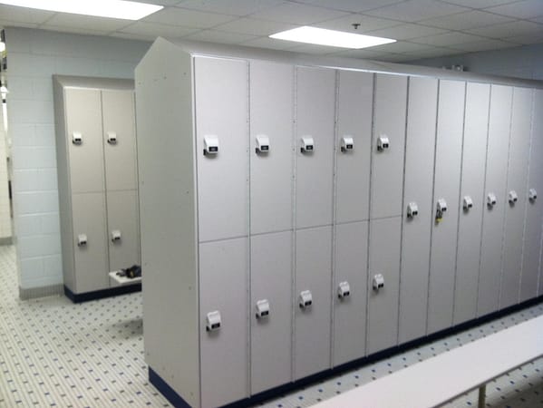 1 and 2-tier HDPE lockers in a locker room with a cement finish, by PSiSC.