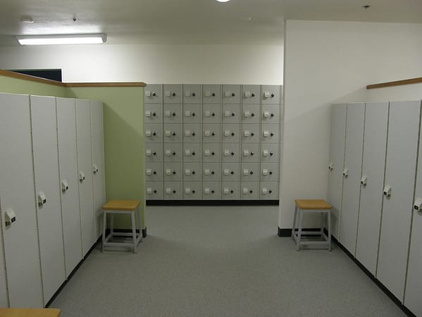 1 and 6-tier HDPE lockers in a locker room with a cement finish, by PSiSC.
