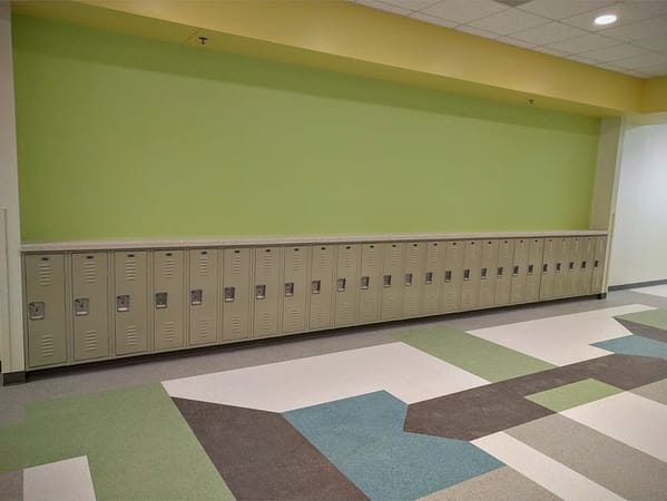 Single Point Latch II Corridor Lockers with a tan finish, by Republic Storage Products.
