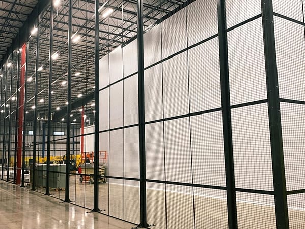 Wire partition cage functioning as a DEA cage, spanning from floor to ceiling to prevent unauthorized access, by Wirecrafters.