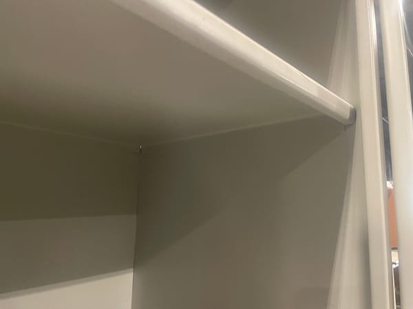 Close up of shelves, showing they are not adjustable.