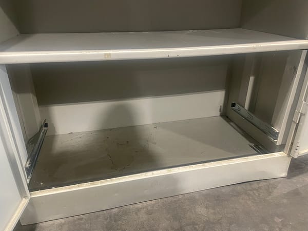 Close up of the bottom of the storage cabinet inside