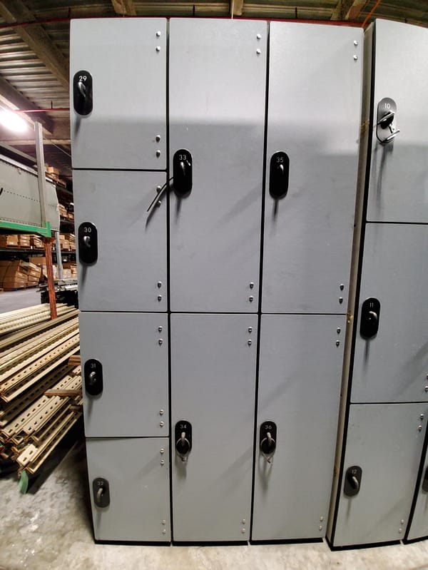 Used four and two-tier phenolic lockers with a gray finish.