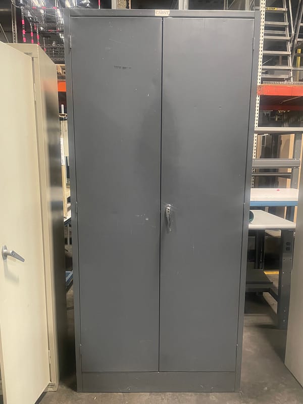 Gray used two door storage cabinet with one handle
